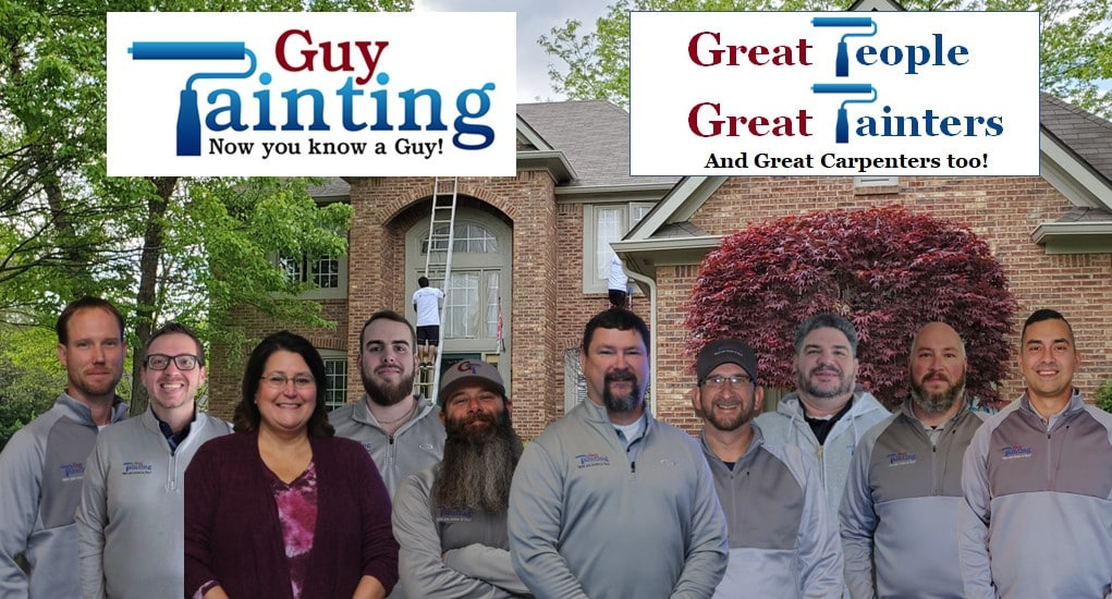 The Guy Painting team of painters, carpenters, and office staff in front of a brick Indianapolis home