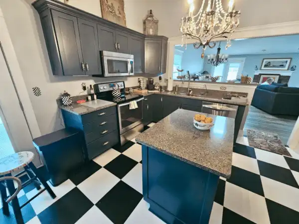 Bright white lake house kitchen cabinets painted by Guy Painting