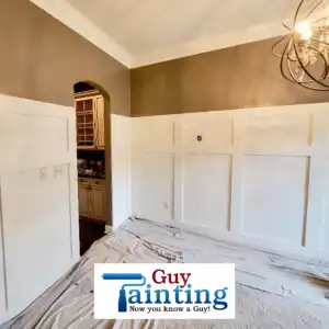 White judges paneling wainscoting on a dining room wall
