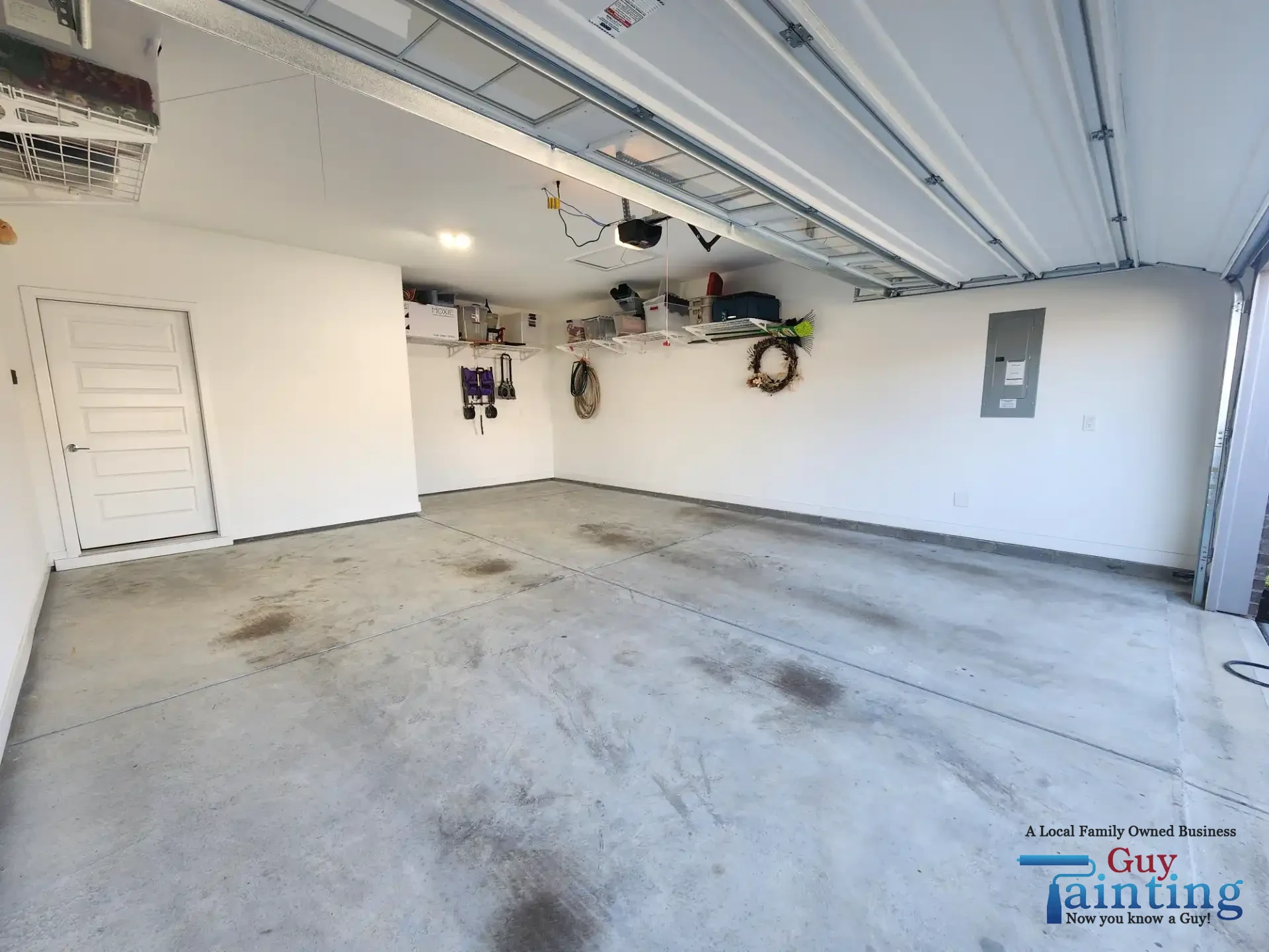 Stained, dusty concrete garage floor before Color Tidal Wave coating, area 4
