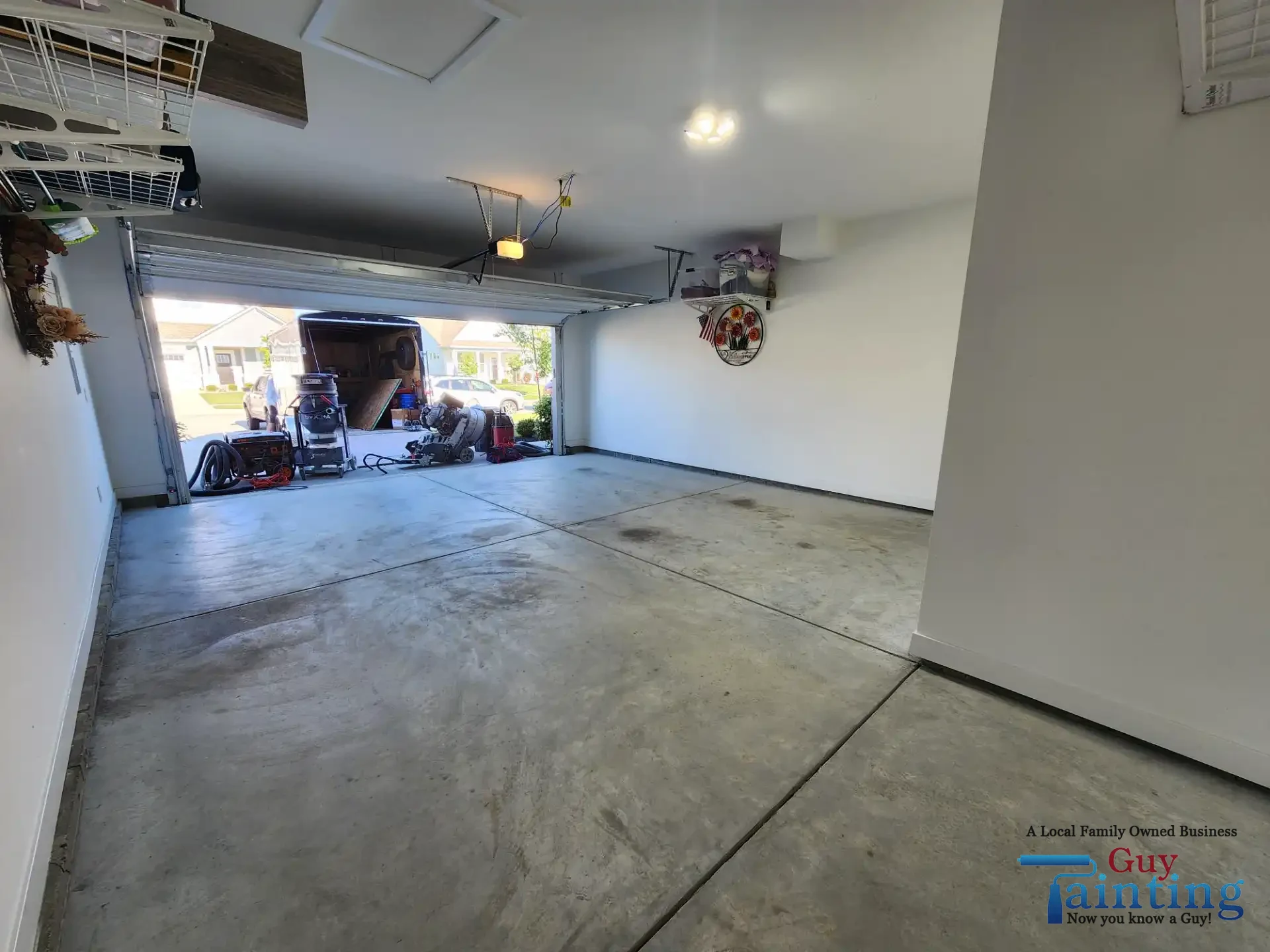 Stained, dusty concrete garage floor before Color Tidal Wave coating, area 2