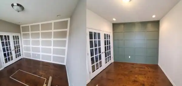 Room with custom white grid box trim and green picture frame moulding accent wall