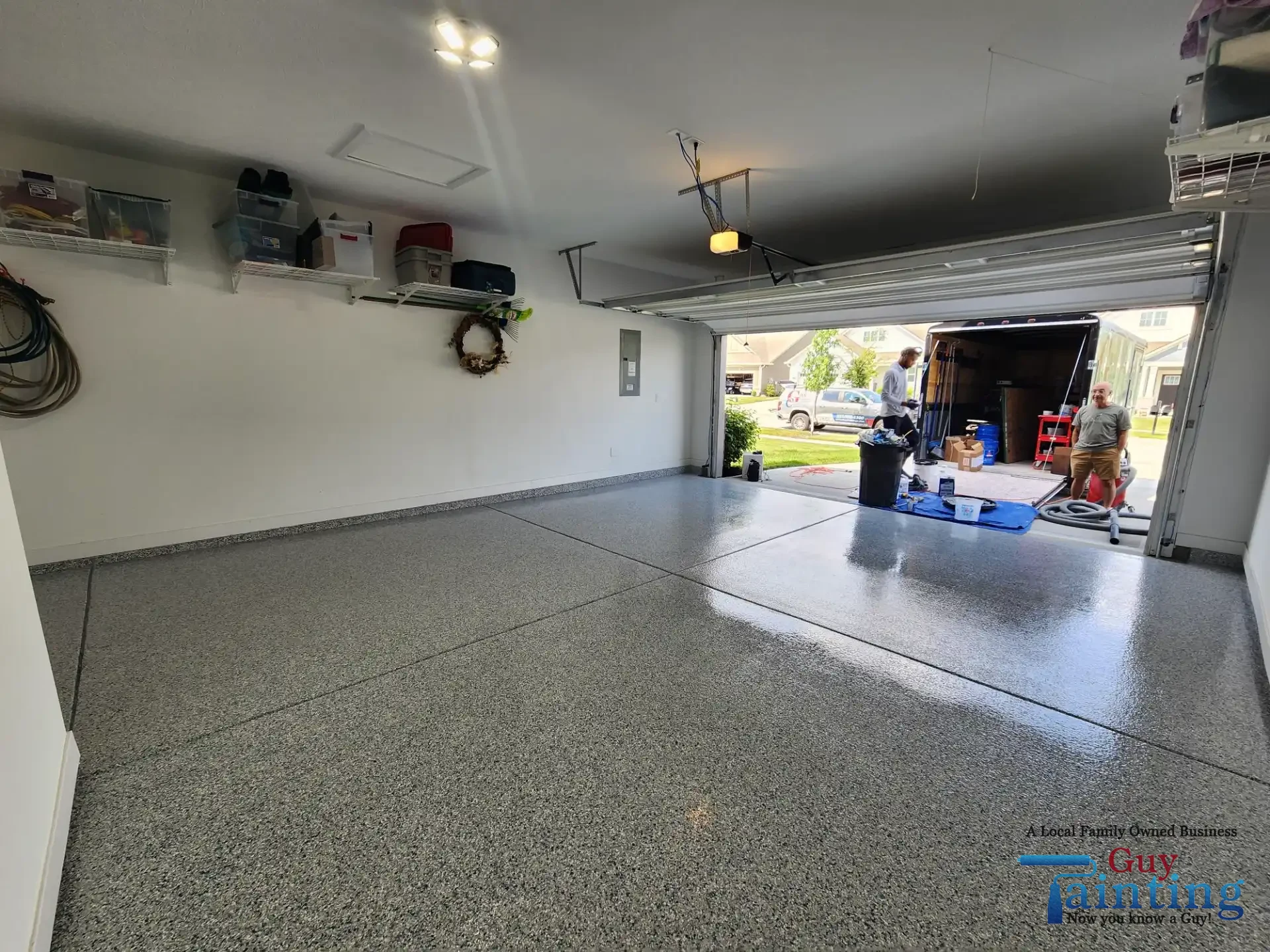 Freshly coated garage floor with Color Tidal Wave speckle finish, area 3