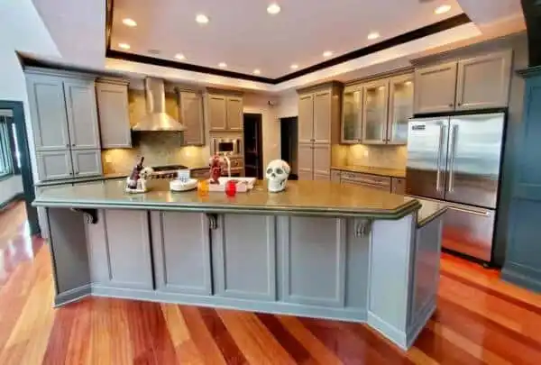 Kitchen cabinets refinished with a factory-smooth painted finish by Guy Painting