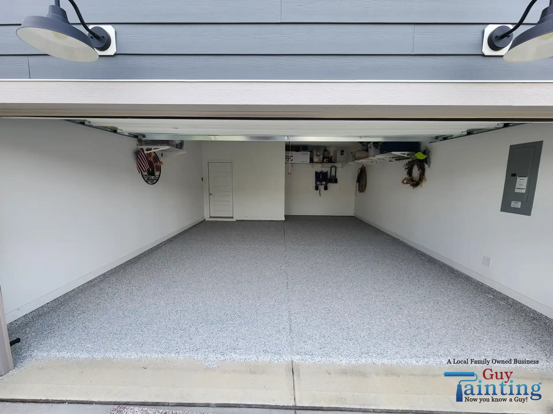 Freshly coated garage floor with Color Tidal Wave speckle finish by Guy Painting