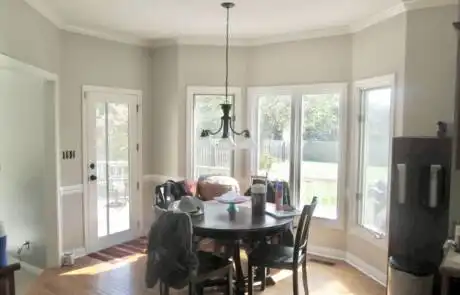 Dining room with freshly painted white baseboards and window trim