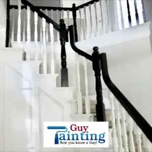 White-painted staircase banister and handrail in an entryway foyer