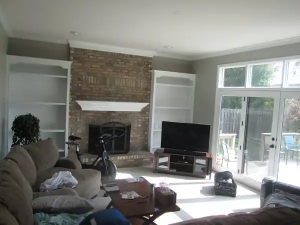 Fresh white painted crown molding and window casing in a bright interior