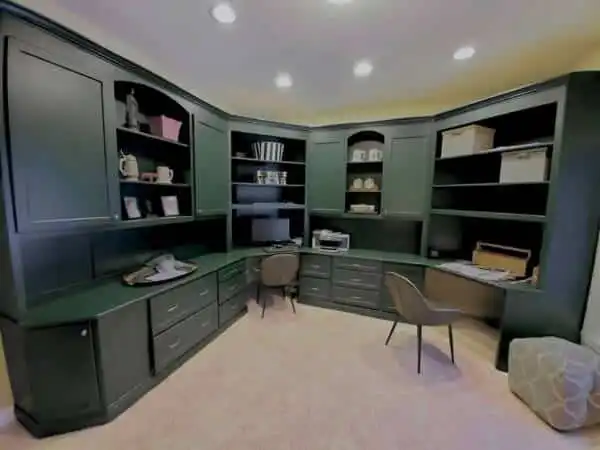 White painted built-in cabinets and shelving in a home office